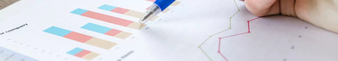 Man showing business graph on wood table